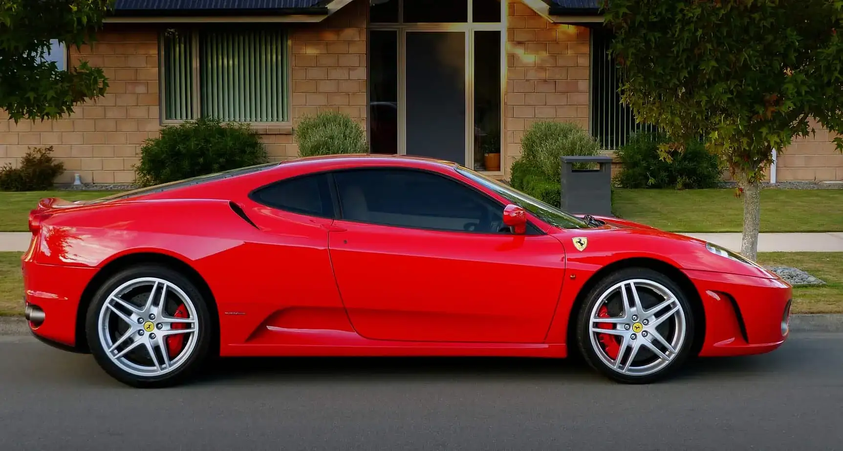 Abbotsford exotic car on flatbed soft-strap transport