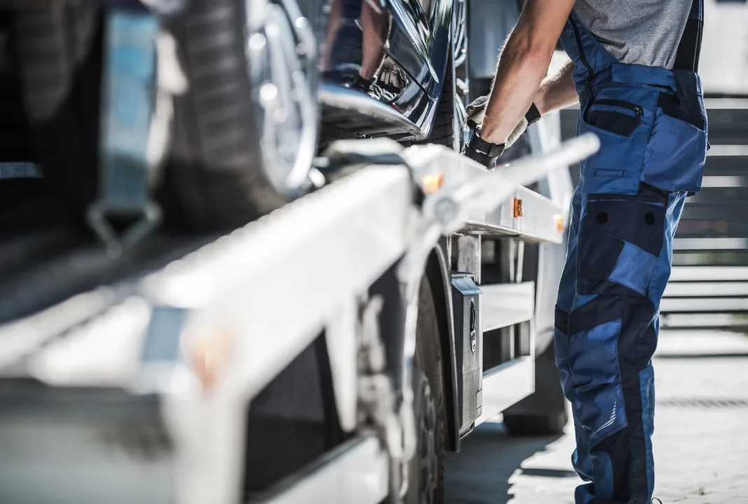 Abbotsford tow truck driver loading a car onto a flatbed